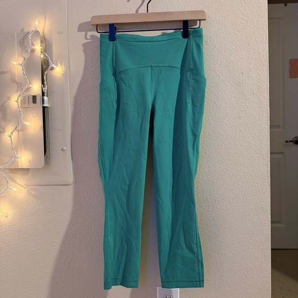 lululemon athletica Pants - Lululemon Teal High-Rise Crop Running Leggings Side Pockets Reflective Size 6